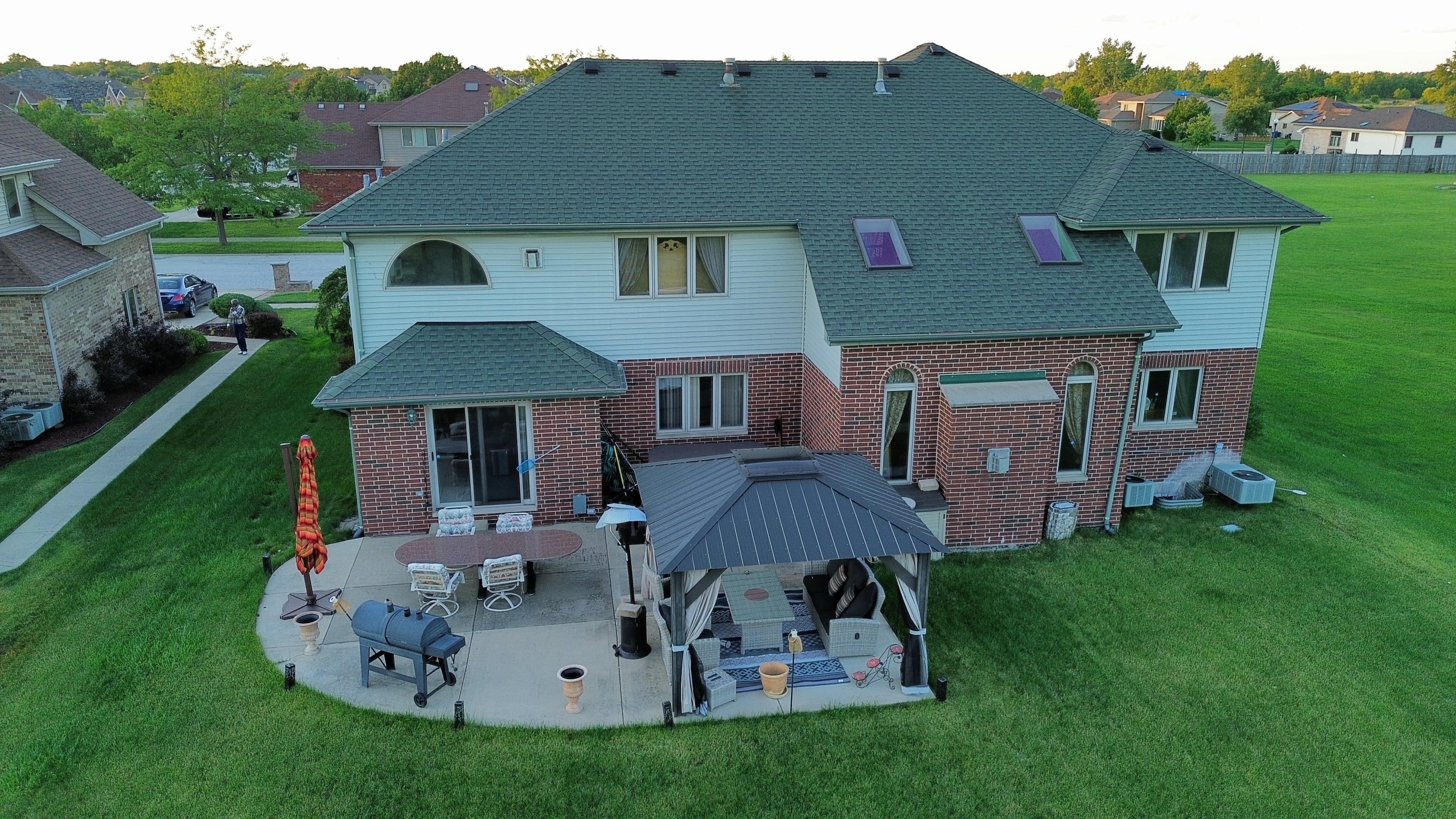 Aerial rear view home with patio and gazebo